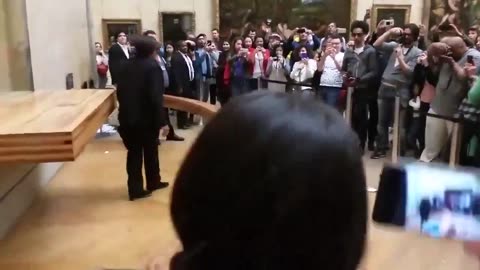 Just in- A woman's naked protest in front of the "Mona Lisa" at the Louvre Museum in France