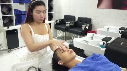Gorgeous like a bride in a wedding dress, she helps me wash my hair and massage my face