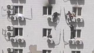 People try to escape burning Beijing hospital