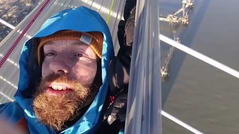 Just Stop Oil activist hangs nearly 450ft above Dartford crossing in makeshift bed