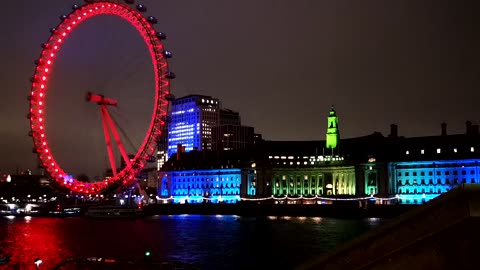 Lights Display On London eye And The Parliament Building