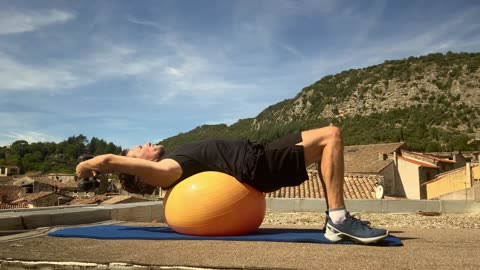 Crunch Arms Over Head on Stability Ball - Dumbbells