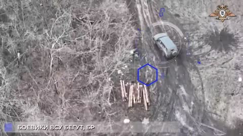 Russian drone drops a grenade on a Ukrainian Target