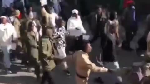 African immigrants who received their documents celebrate in the streets of