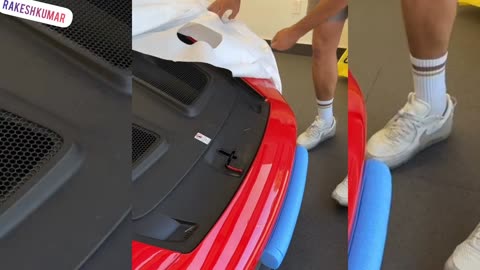 Unrapping brand new Porsche car