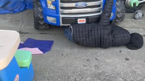 Mom Films Video Of Son Under Toy Car Pretending To Be A Mechanic