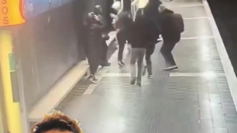 North African migrant in Barcelona walking through the metro station openly attacking women.