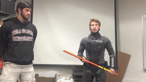 Guy Tests His Real-Life Batsuit Against An Iron Pipe