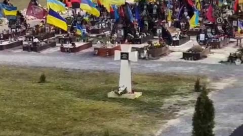 Lviv (Lwow), Western Ukraine cemetery displays Ukrainian flags and Red & Black flags