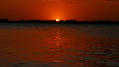 Sunset over lapping water