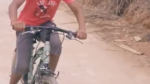 Bicycle stunt by a young boy...