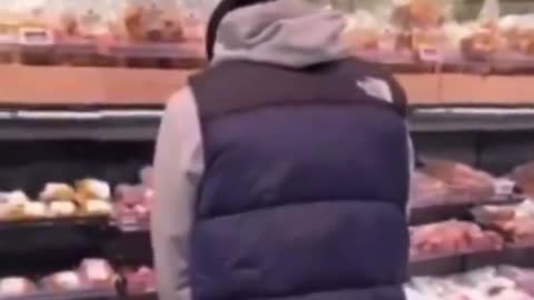 Young Islamist in the Netherlands urinates on the pork section of a supermarket