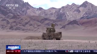 China broadcasts footage of military drills