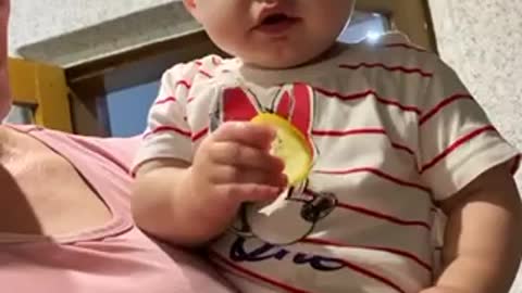 Child eating lemon