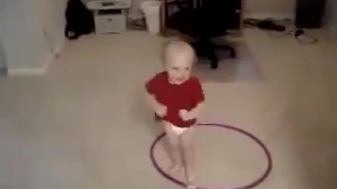 child dancing hula hoop