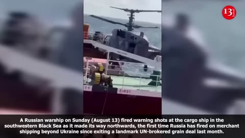 Russian soldiers seen boarding helicopter from cargo ship after firing warning shots to stop it