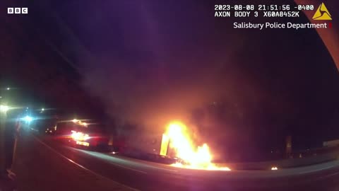 North Carolina: Moment police officer rescues driver from burning truck
