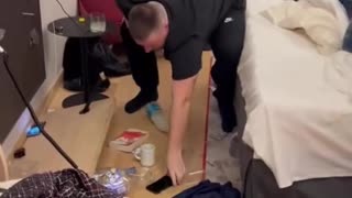 Guys Break Shelf in Hotel Room