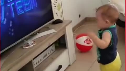 ADORABLE BABY BOY GETS EXCITED WHILE WACTHING TV AND DANCES TO THE SOUND