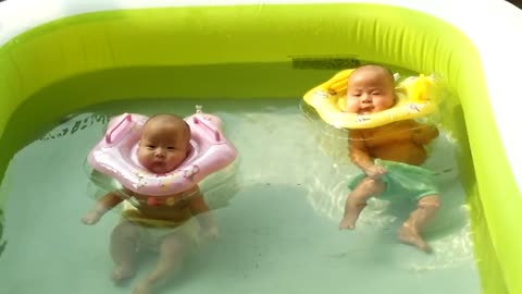 2-Month-Old Twin Babies Enjoy Pool Time