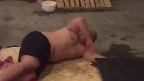 Shirtless guy jumps onto wooden beer pong table and snaps it