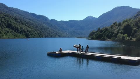 People on Dock with Inflatable Boat