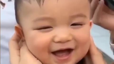 baby cries with laughter and bursts out laughing