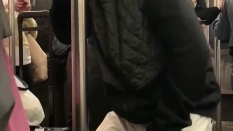 Old guy bald dancing subway pole