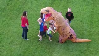 Group Of Kids Ambush Man In A T-Rex Costume