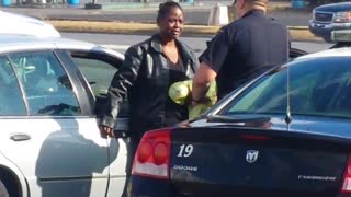 Officers helps lady buy eggs