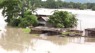 Floods inundate villages, city streets in northeast India