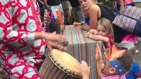 Toddler plays bongos at Animal Kingdom!