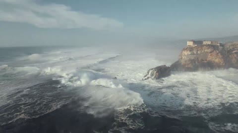 Large waves crashing on the rocky shore