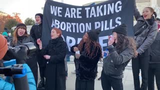 Pro-Choice Demonstrators Swallow ‘Abortion Pills’ on Steps of the Supreme Court