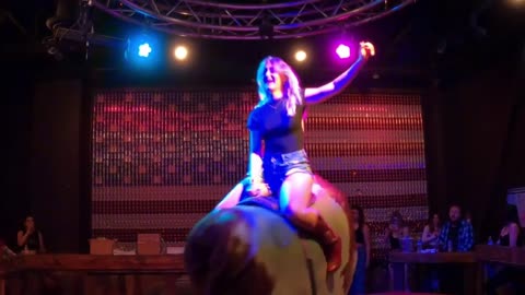 Mechanical bull riding in Las Vegas: A female cowpoke thinks the bull is tame but he has other ideas