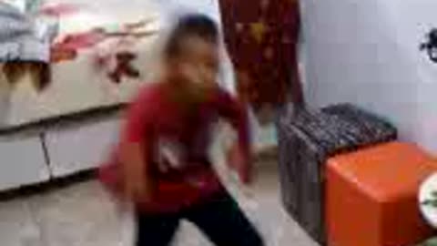 Funny boy at home dancing