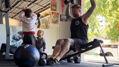 Youngster Accidentally Drops Dumbbell on Dad During His Workout