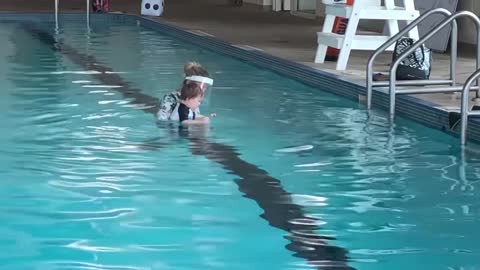 baby swimming in swimming pool amazing 6 months old talented baby