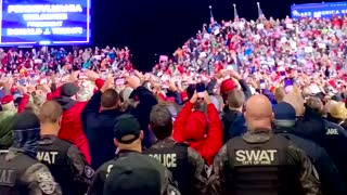 Trump crowd chants USA while swat team takes snaps