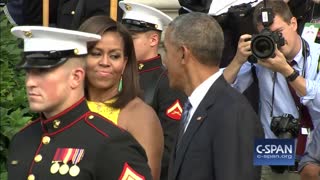 Michelle Obama picking Barack Obama's nose in public
