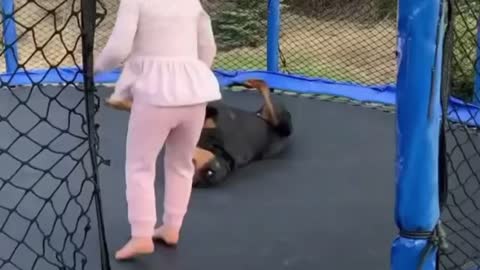 Dog and girl on Trampoline