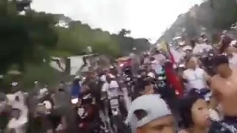 The Bolivarian National Guard of Venezuela joins them in their march toward Guarenas