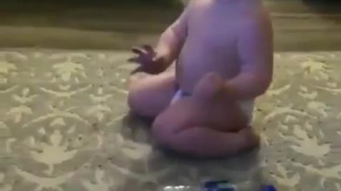 Cute Baby Doing Bottle Trick