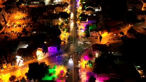 Aerial Time Lapse Footage Of Colorful Lights In The Street At Night