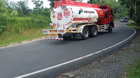 tanker truck going up a sharp incline