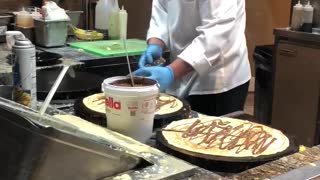 Watching them make a crepe- NY NY