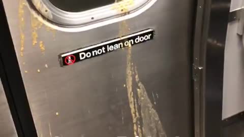 Vomit on the subway train doors