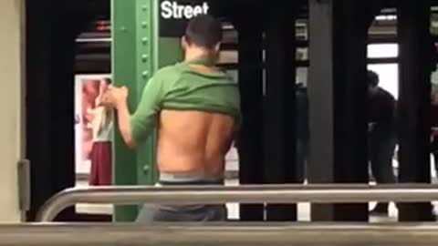 Guy 59 street humping green beam pole subway station platform