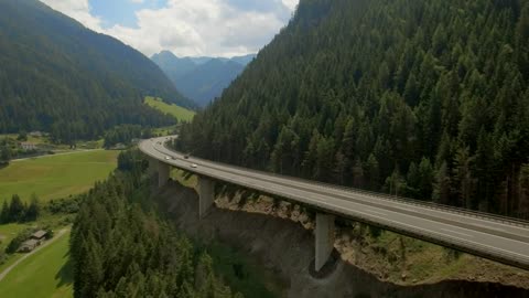 Aerial view of highway bridge along mountain ridge