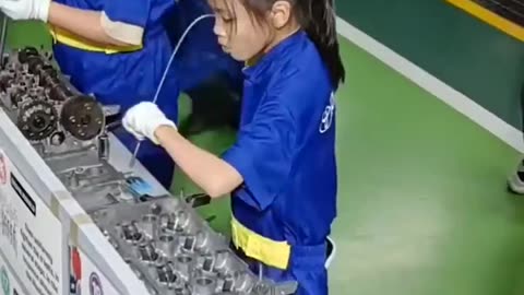 School kids In Japan learning car maintenance